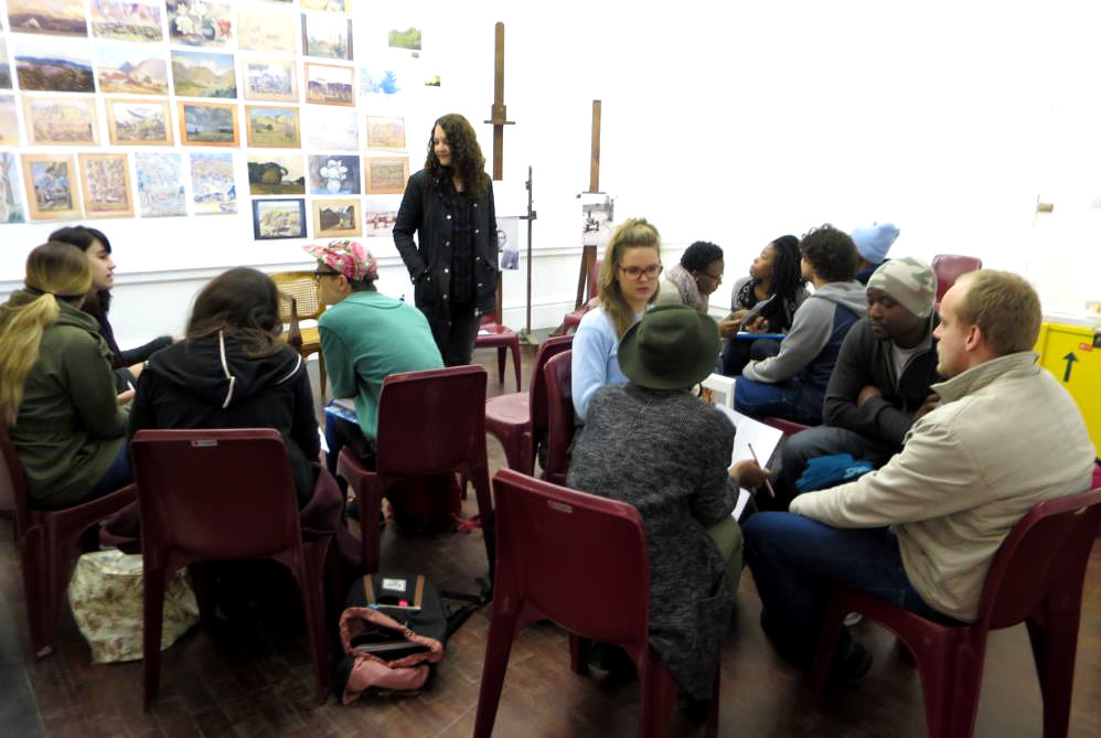 Click the image for a view of: Andrew Lewis, Curator of the Tladi with the UCT CCA students